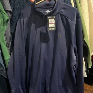 Men’s under armor 1/4 zip navy blue color size 2 XL knit measures 28 pit31 down